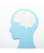 A silhouette of a head with puzzle pieces for a brain