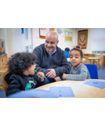 Chief Nursing Officer for England Duncan Burton meets children taking part in the Tiny Teeth toothbrushing initiative at Life Bank Nursery in Liverpool
